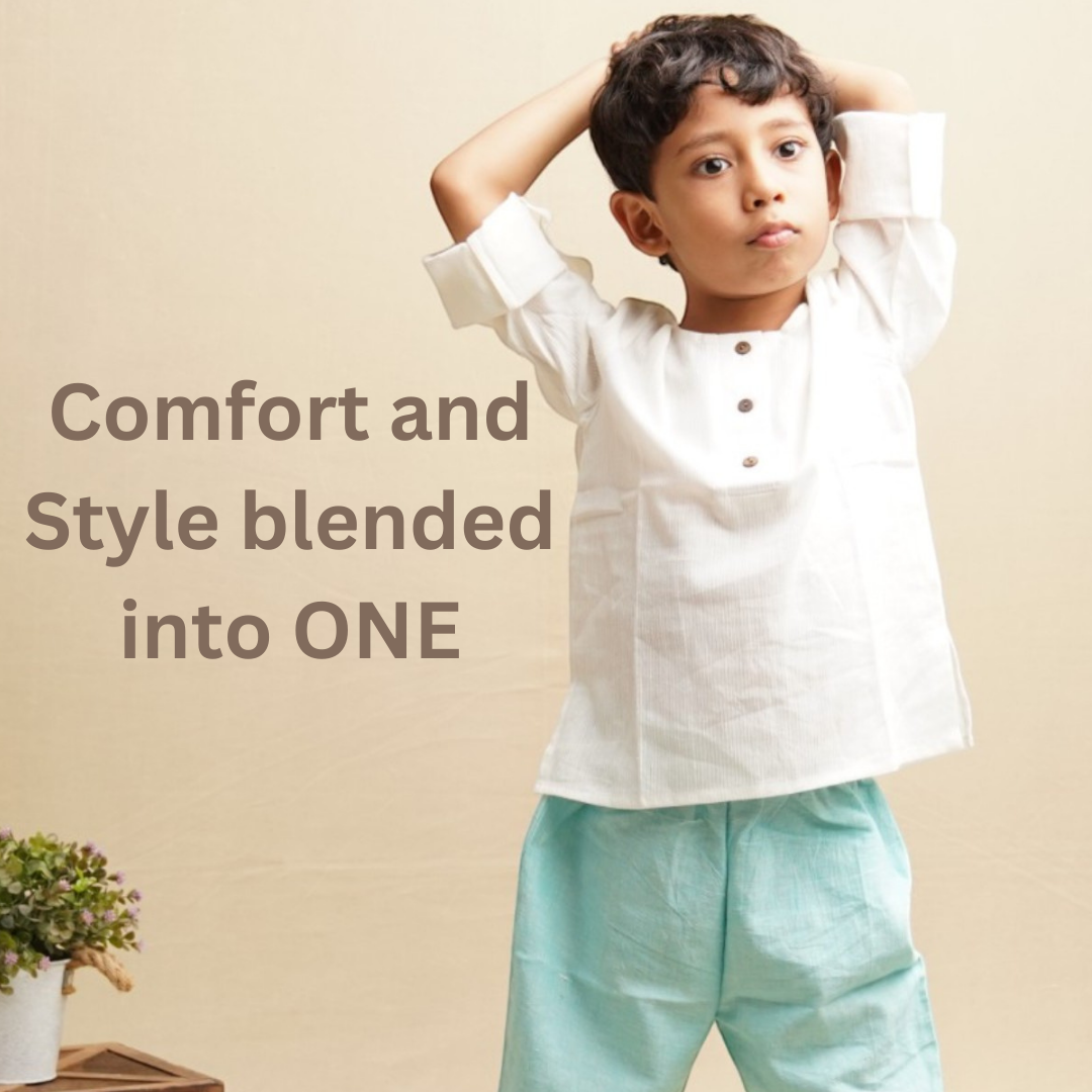 Child wearing a white khadi shirt and light blue khadi pants with text 'Comfort and Style blended into ONE' on a beige background.