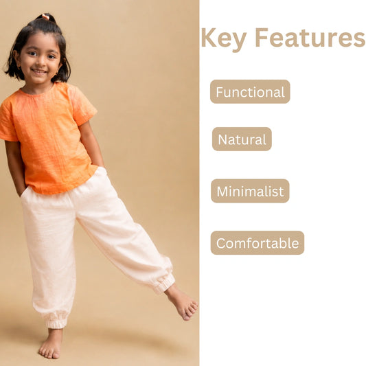 Girl wearing cream handwoven cotton joggers with an orange top, next to key features: functional, natural, minimalist, comfortable