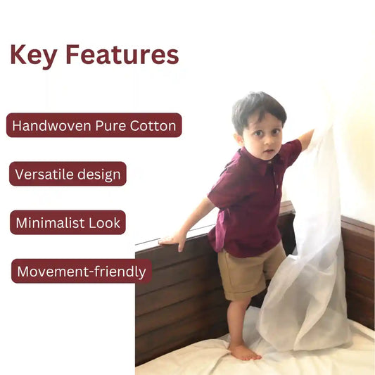 Boy in a maroon polo neck shirt and beige shorts standing on a bed, with key features of the set listed