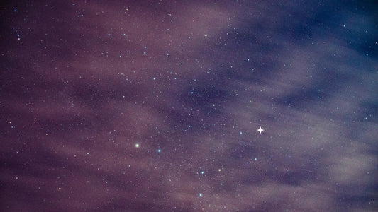 Purple night sky with scattered stars and soft clouds for children’s decor or toys theme