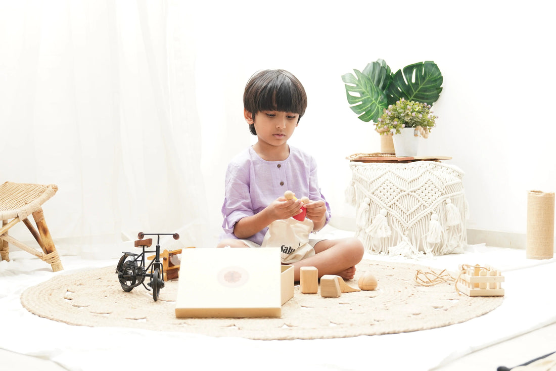 Child in pastel shirt playing with wooden Montessori toys on a round woven rug in a bright room