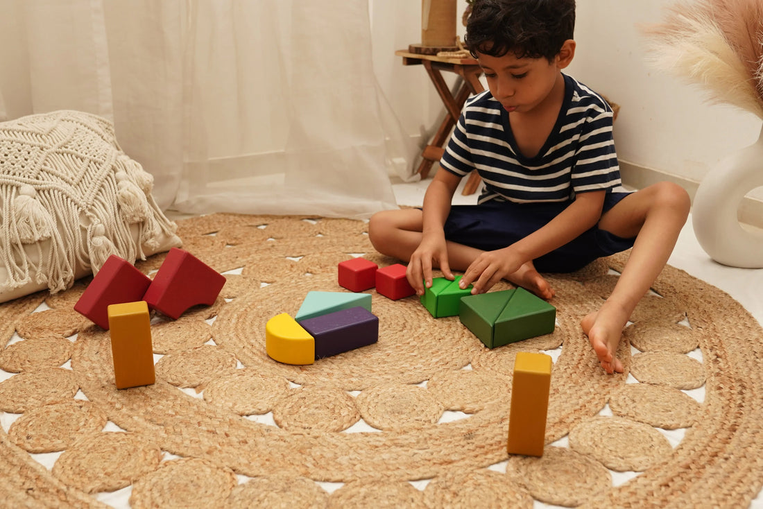 Child playing with colorful wooden educational blocks on a woven mat in a cozy room