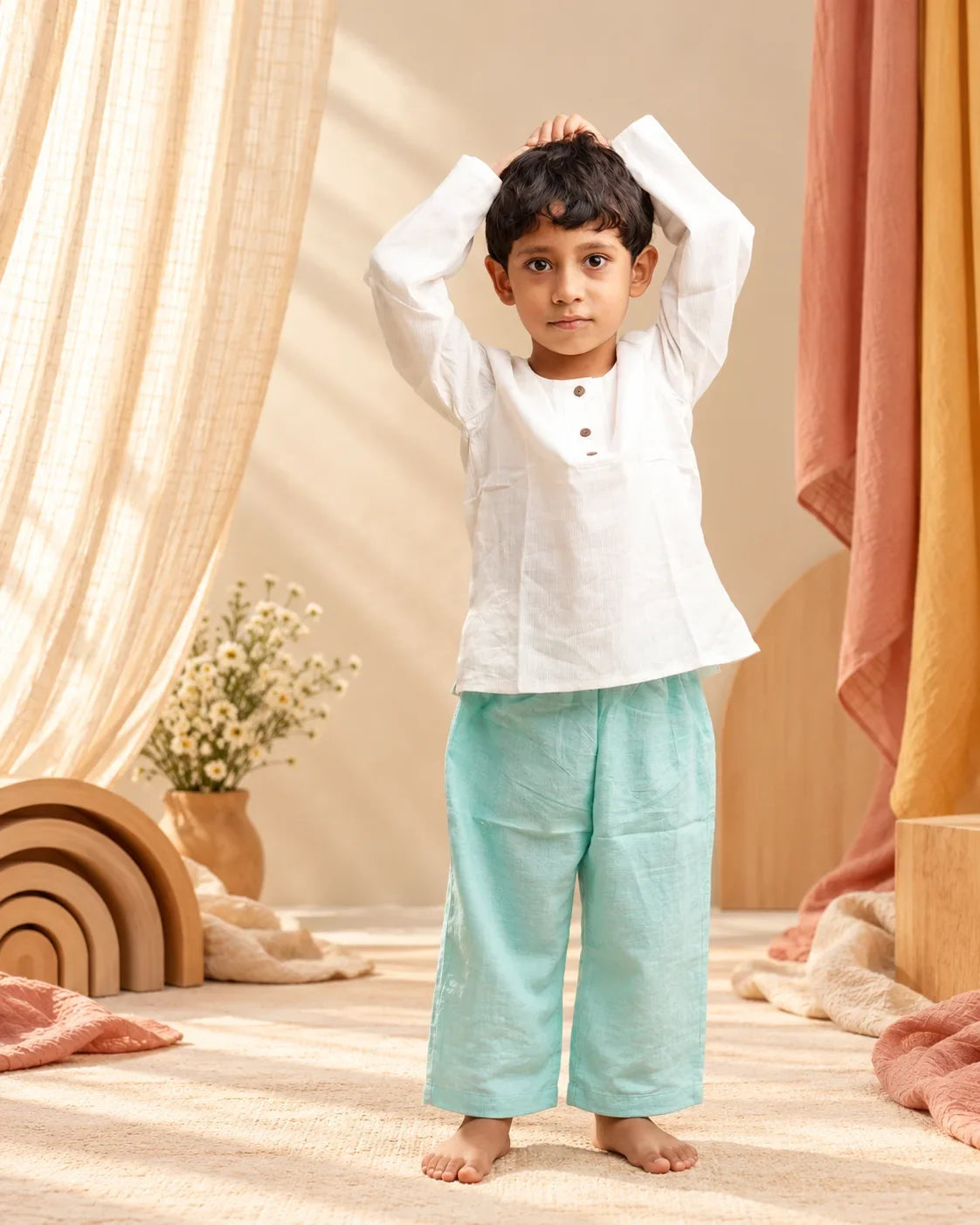 little boy wearing pure cotton clothes in a waldorf background