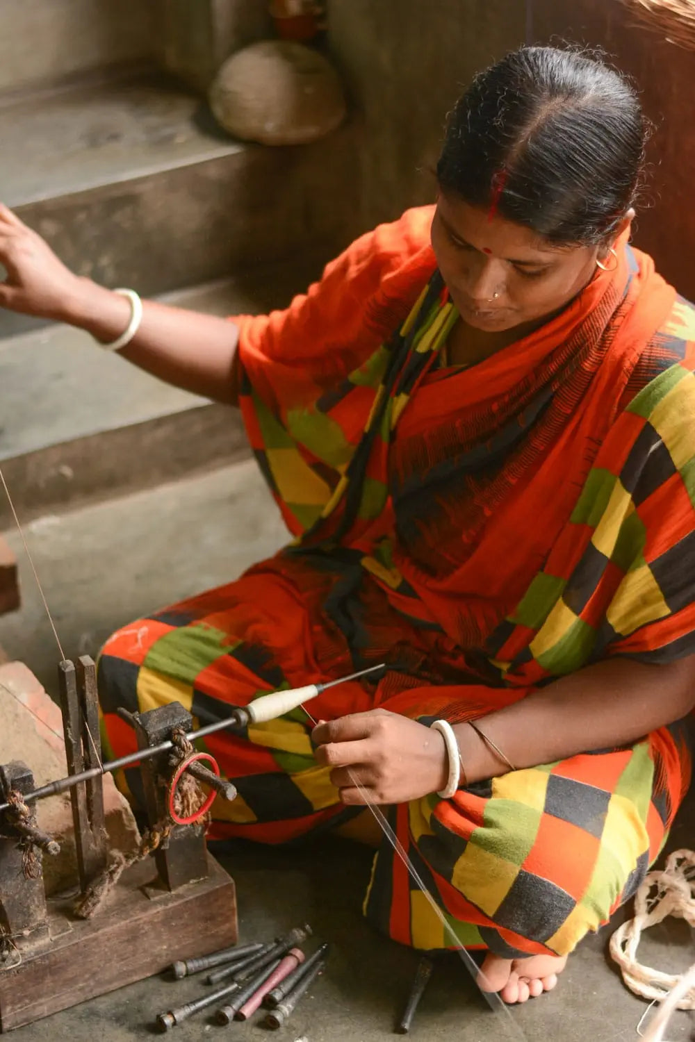 Woman artisan working on producing khadi
