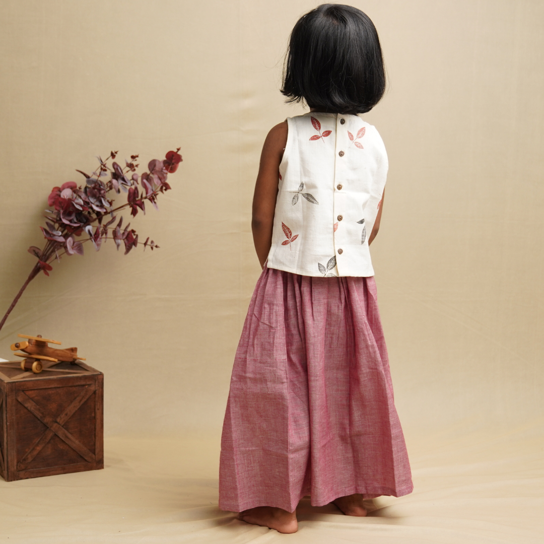 Girl wearing khadi ethnic wear showing Backview of handspun khadi skirt and top set 