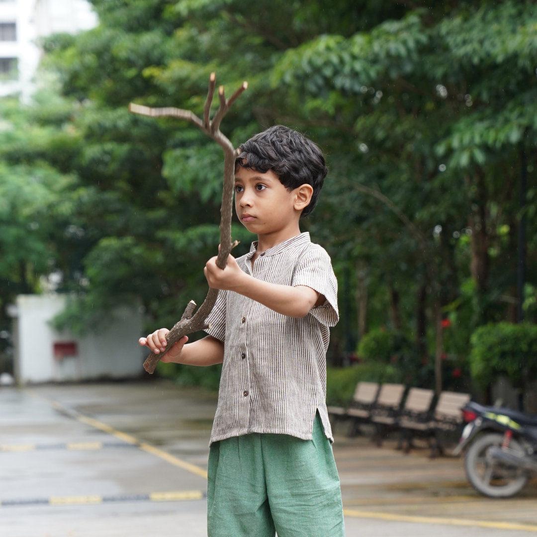 Boy wearing comfortable cotton clothes and playing outside