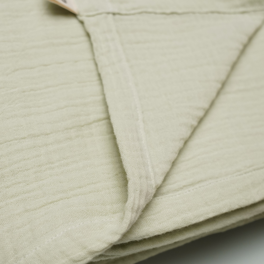 Close-up of Muslin Newborn Baby Swaddle in Pista Green
