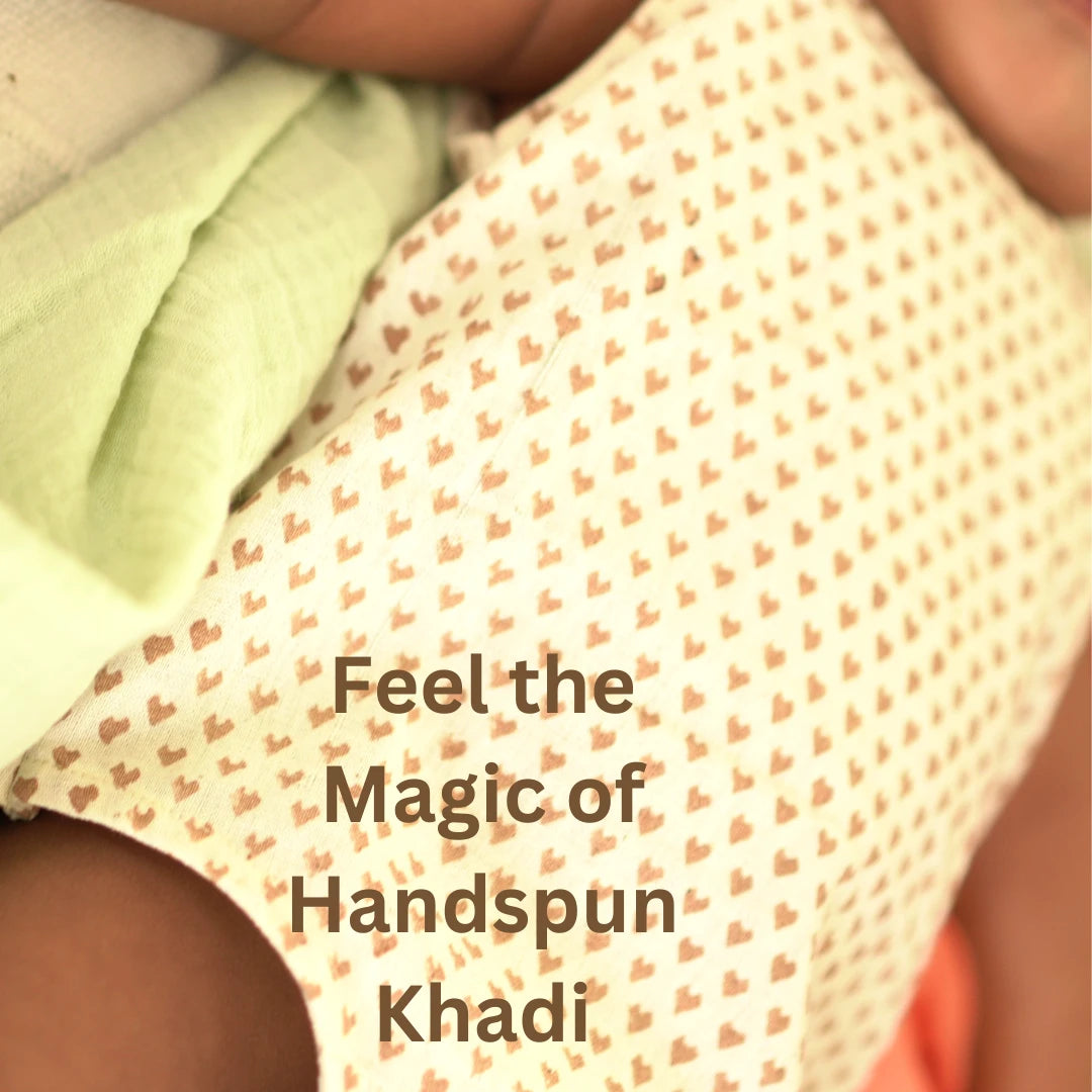 Close-up of soft handspun khadi fabric with delicate heart prints used in the breathable Cotton Onesie for babies