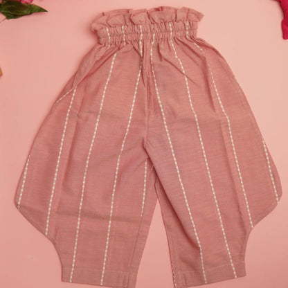 Flat lay of pink handloom cotton pants with soft elastic waist and white striped detailing for comfortable movement