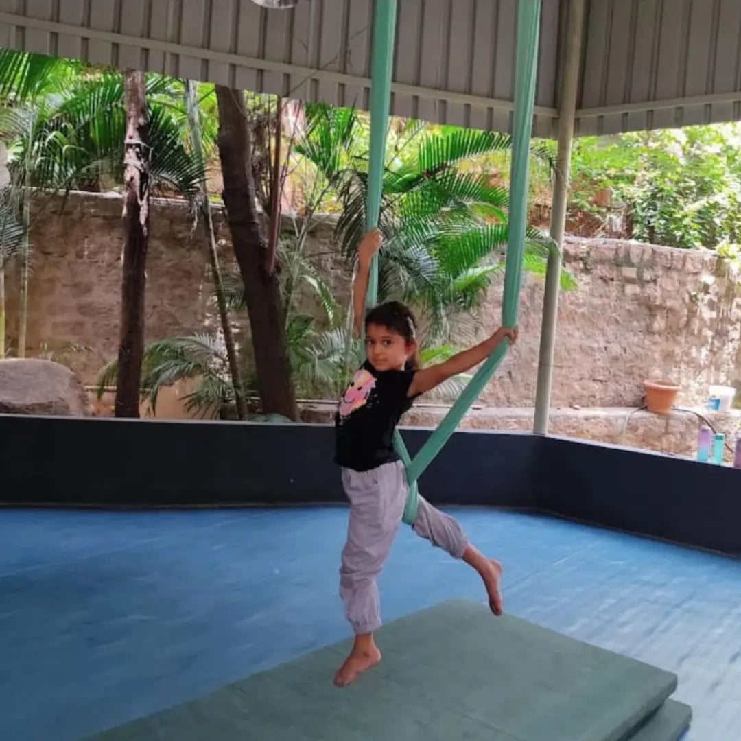 Child wearing cotton jogger performing a gymnastic routine 