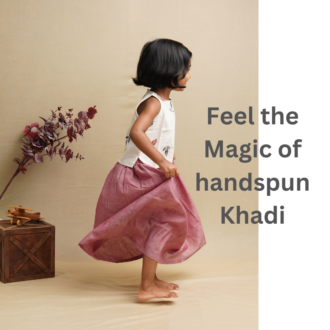 Playful Girl wearing Khadi Ethnicwear set against beige background