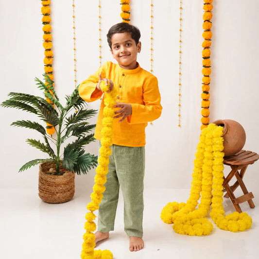 Boy wearing kurta pant set in a festive set-up
