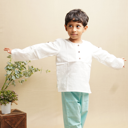 Boy stretching his hand wearing full sleeve cotton shirt in white color
