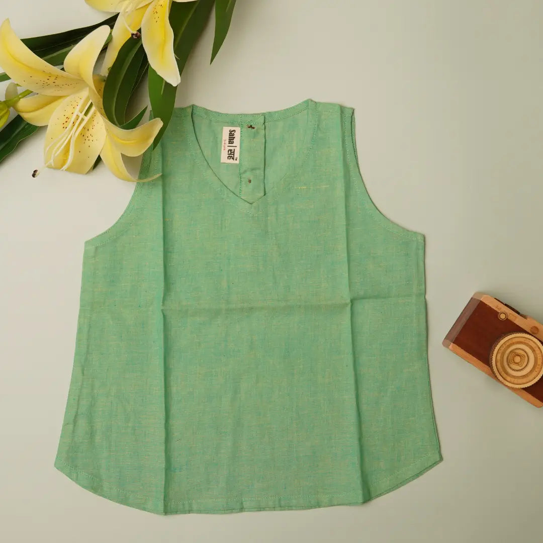 Flat lay of baby girl dress top in cotton khadi – breathable natural toddler outfit