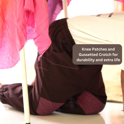Close-up of khadi cotton pants with durable knee patches and gussetted crotch for active play.