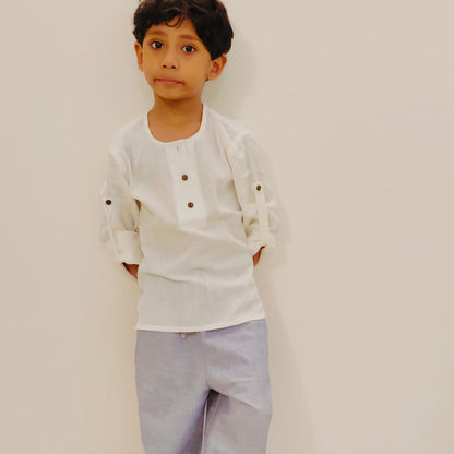 Boy wearing khadi shirt and cotton joggers set – breathable everyday outfit for kids