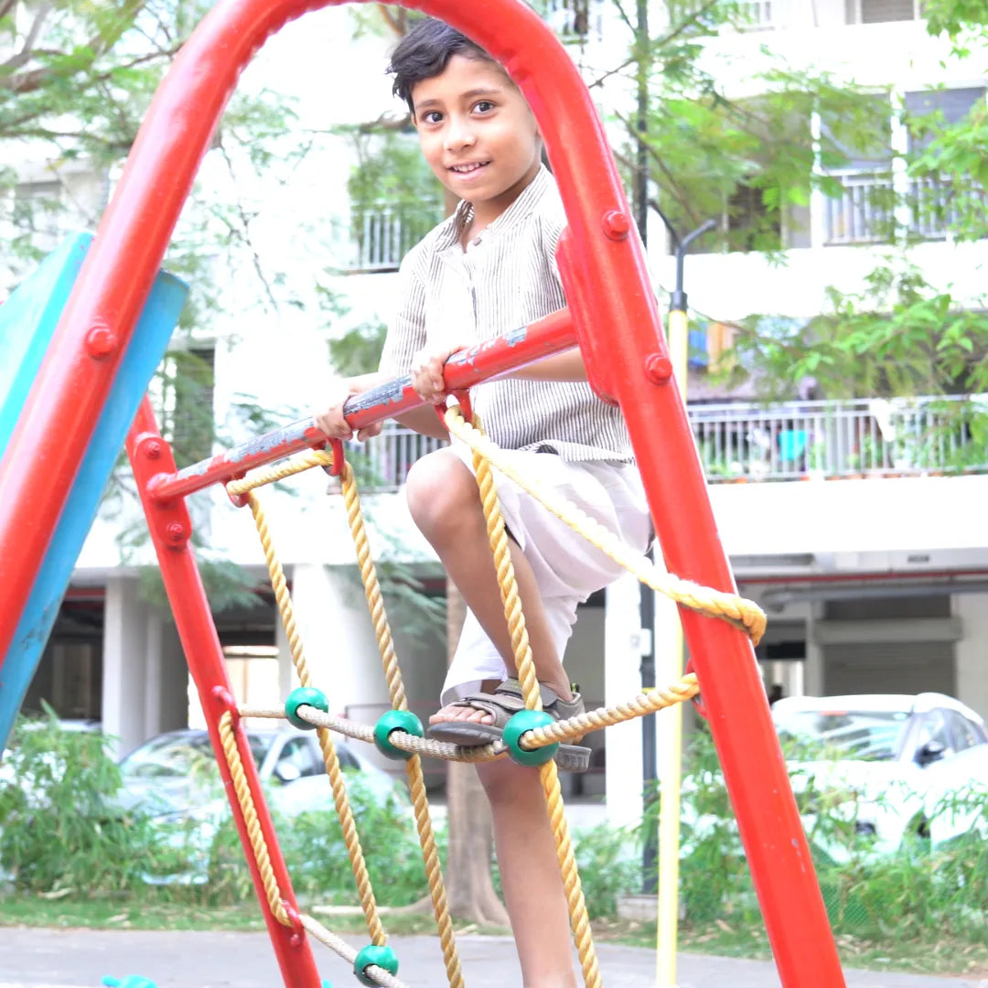 Boy wearing Little Trailblazer shirt and shorts set – comfortable outfit for play and outings