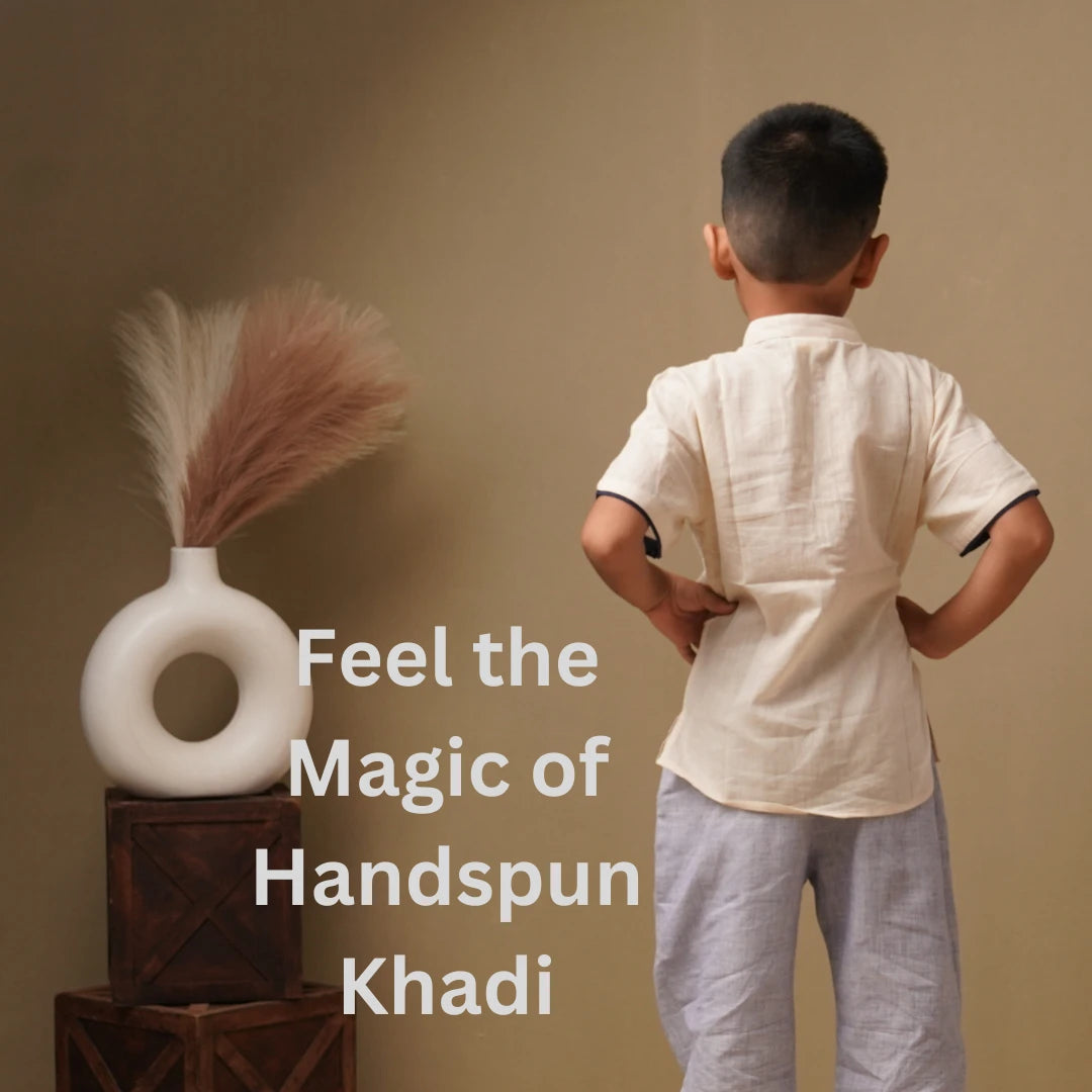 Child wearing a handspun khadi outfit with text 'Feel the Magic of Handspun Khadi' on a beige background.