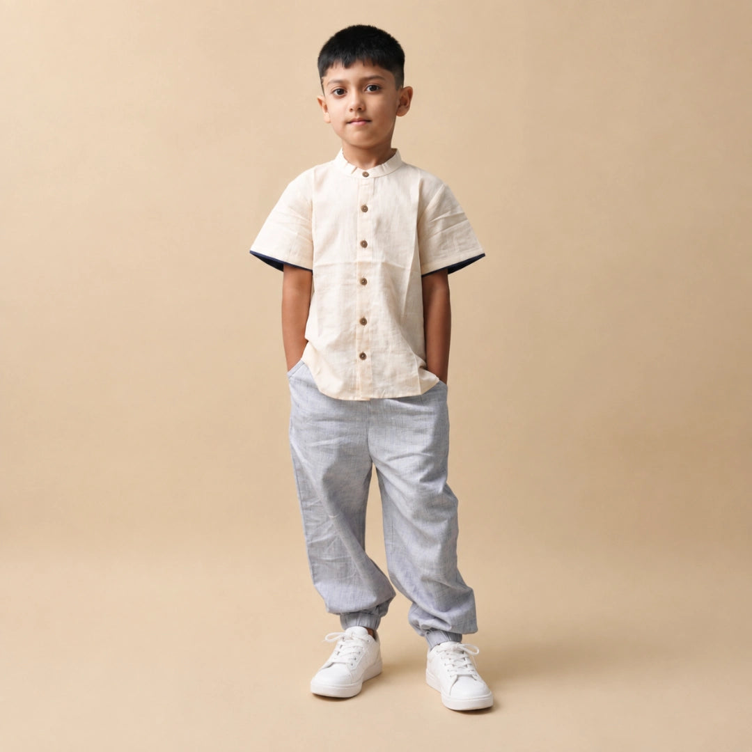 Boy wearing a comfortable jogger and shirt set in breathable natural fabric