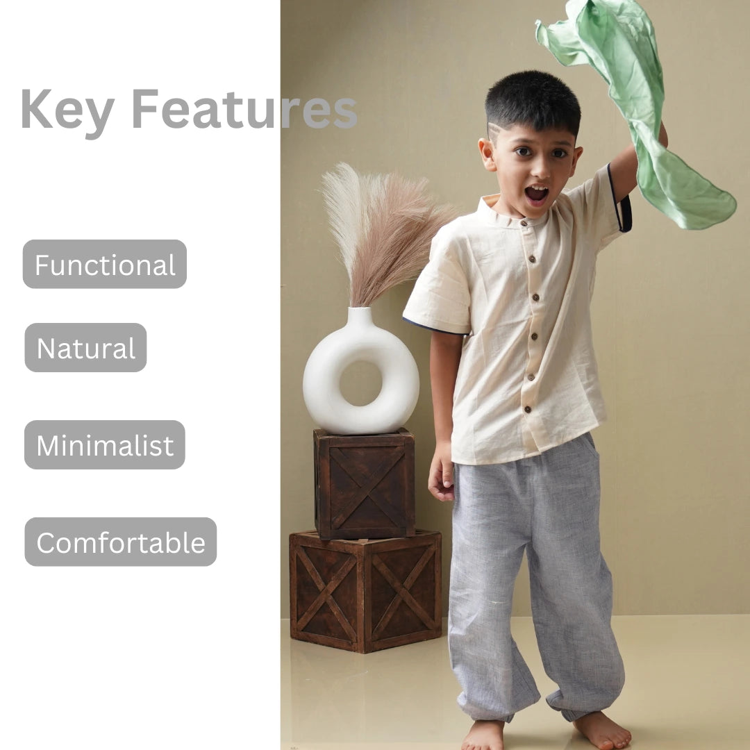 Boy wearing a natural jogger and shirt set designed for comfort and movement