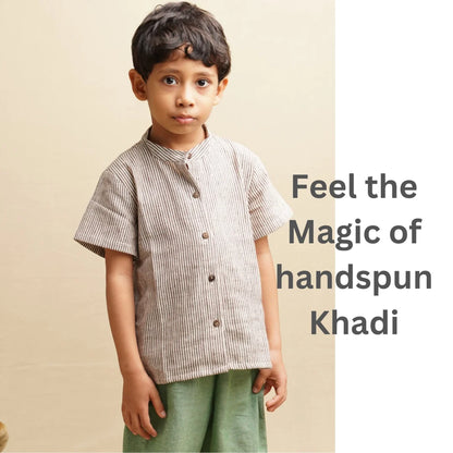 Boy wearing a striped khadi shirt with comfortable green trousers