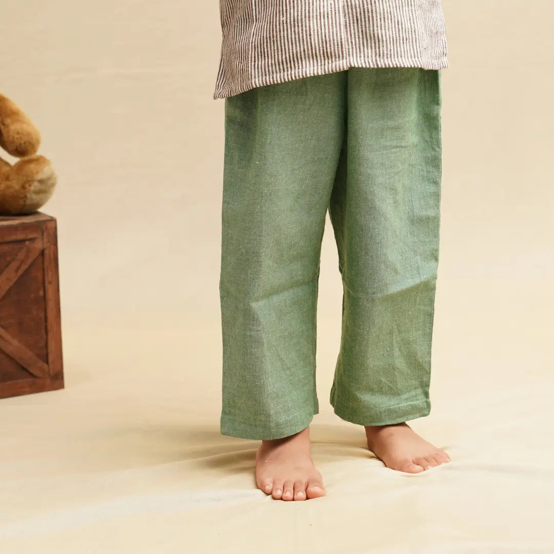 Close-up of green khadi trousers from a boys clothing set