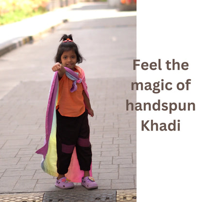 Child wearing handspun khadi unisex joggers styled for imaginative and comfortable everyday play.