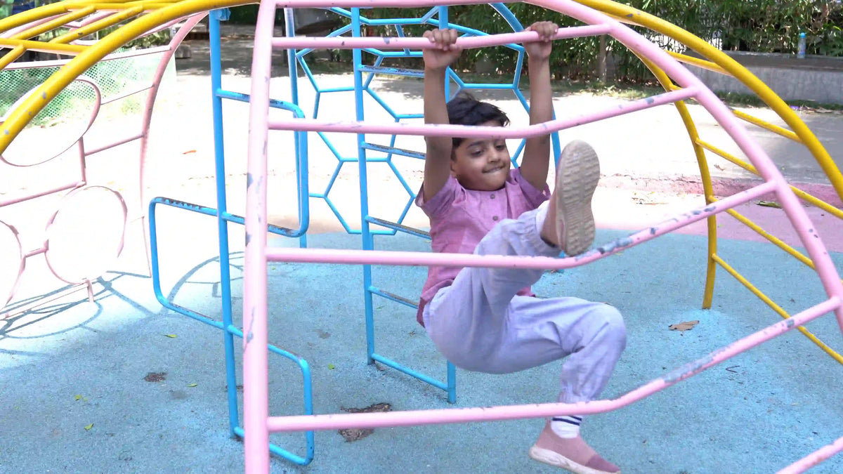 Child wearing pure cotton uniform and playing in the park