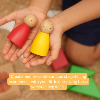 Child holding colourful Wooden Peg Dolls made from premium beechwood for imaginative role play and open-ended learning