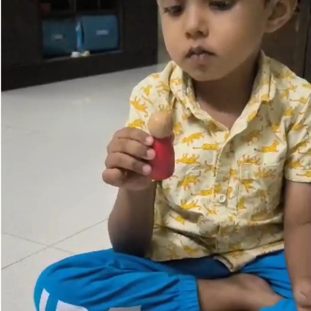 Child playing with wooden toys