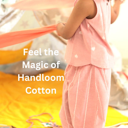 Close-up of breathable pink handloom cotton coord set with sleeveless top and striped pants highlighting natural fabric texture
