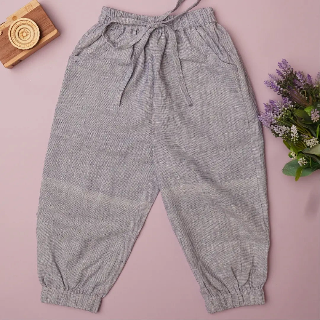 Flat lay of cotton joggers for boys– breathable natural outfit for kids