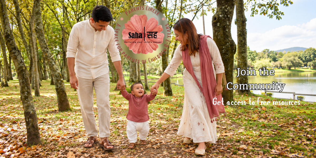 Joyful Indian Family with a young child walking by the pond