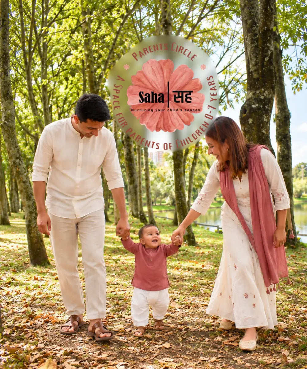 Joyful Indian Family walking by the pond