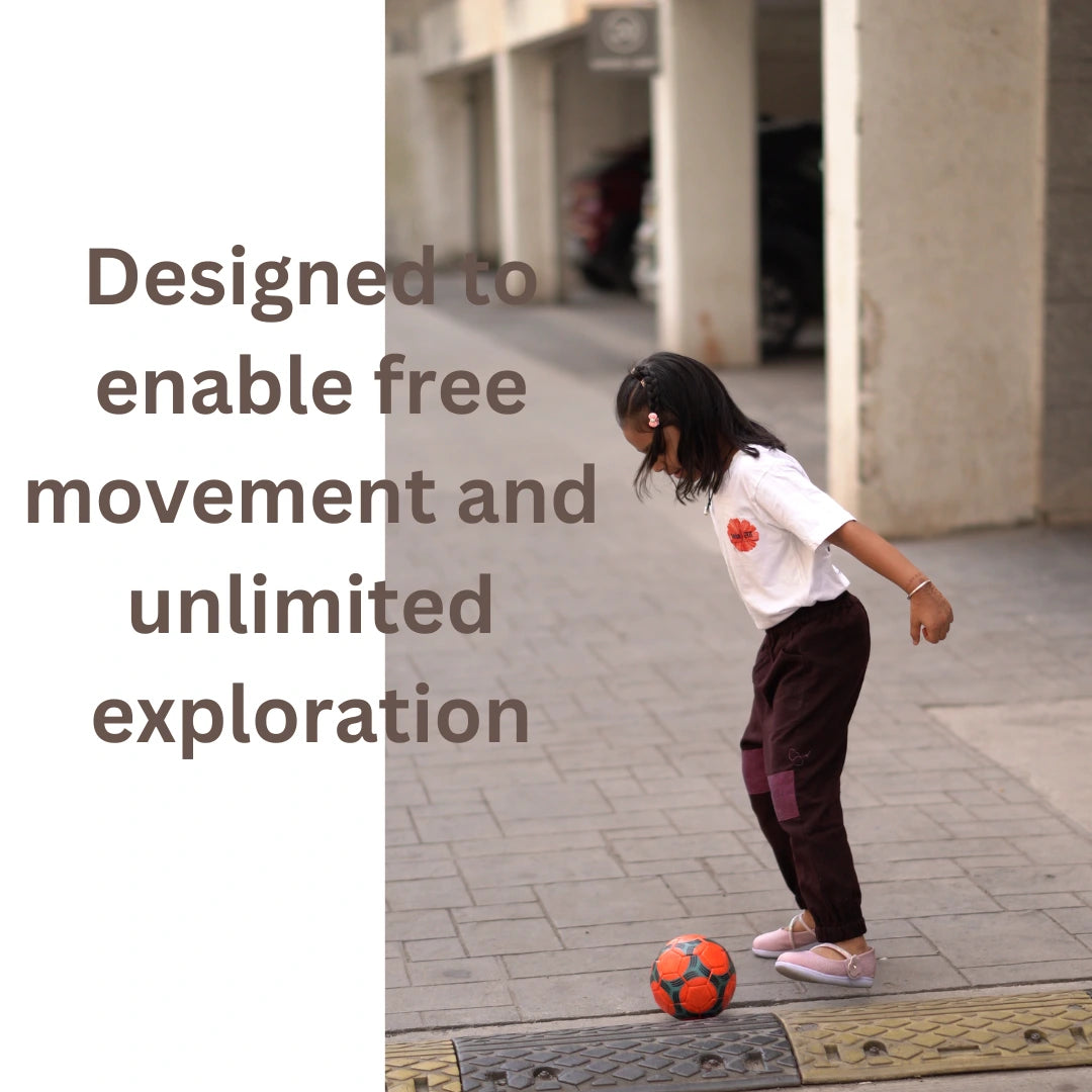 Girl playing outdoors in movement-friendly unisex joggers made from soft handspun khadi cotton.