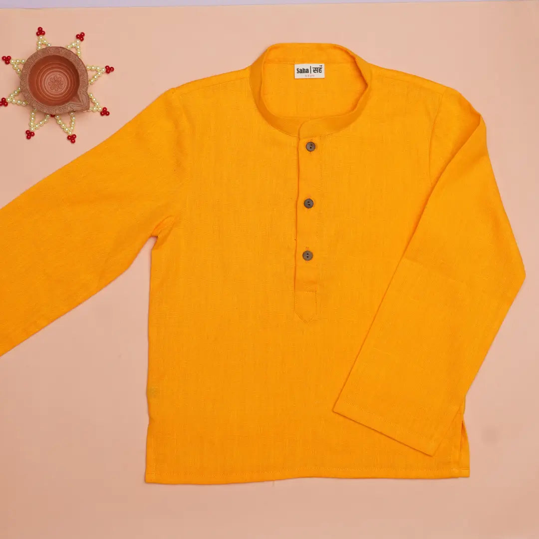 Close up of handwoven khadi cotton fabric on Genda Phool boys kurta – natural and breathable texture