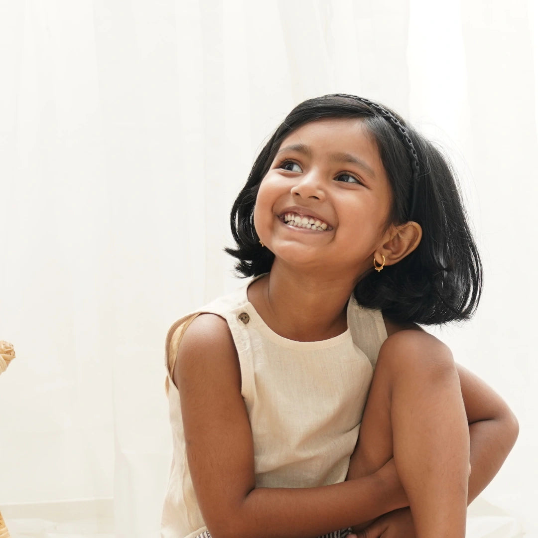 Close up of handwoven khadi cotton used in Frilly Fun crop top for girls – breathable texture