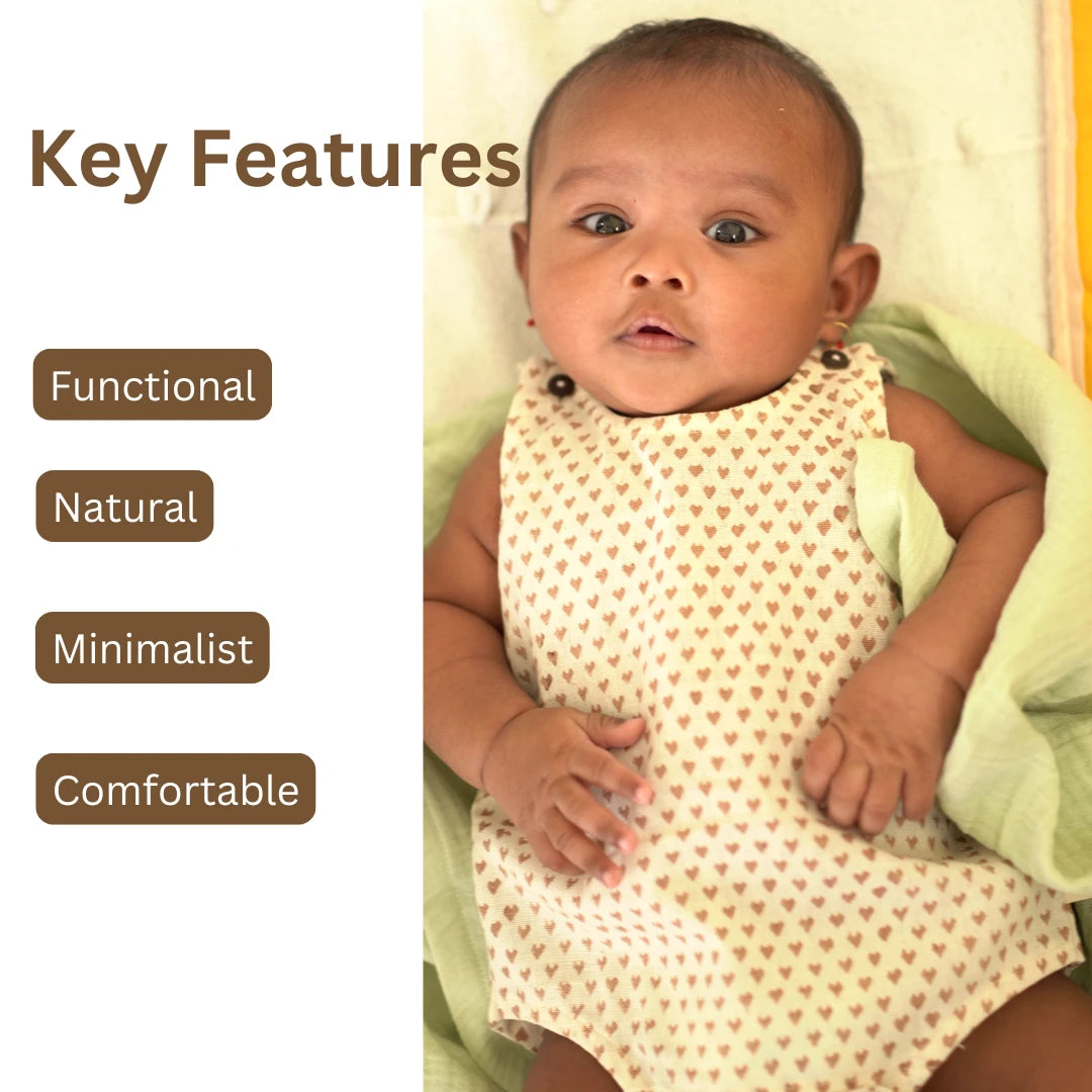 Minimalist khadi Cotton Onesie for babies featuring heart prints with key features like functional design, natural fabric, and comfort fit