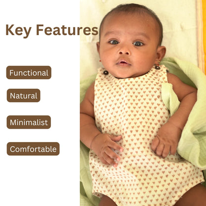 Minimalist khadi Cotton Onesie for babies featuring heart prints with key features like functional design, natural fabric, and comfort fit