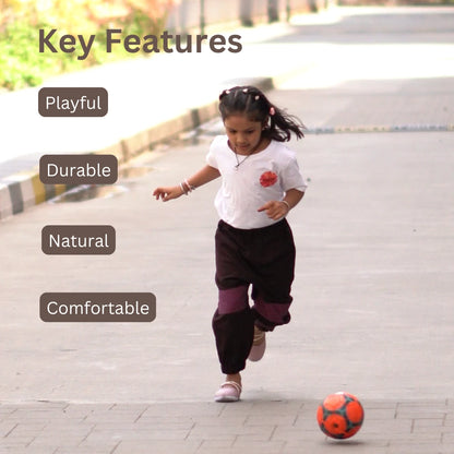 Young girl running freely in breathable khadi unisex joggers designed for comfort and movement
