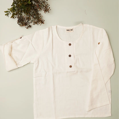 Flat lay of white khadi shirt – breathable natural outfit for kids