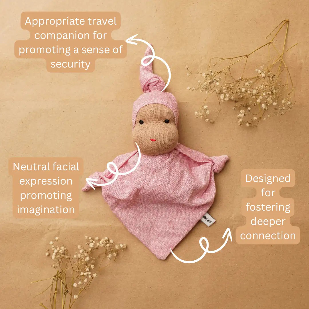 Pink Waldorf-inspired cuddle doll with a neutral facial expression, designed to encourage imagination, sensory exploration and open-ended play.