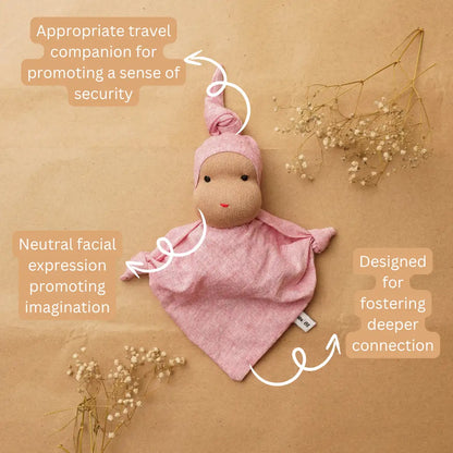 Pink Waldorf-inspired cuddle doll with a neutral facial expression, designed to encourage imagination, sensory exploration and open-ended play.