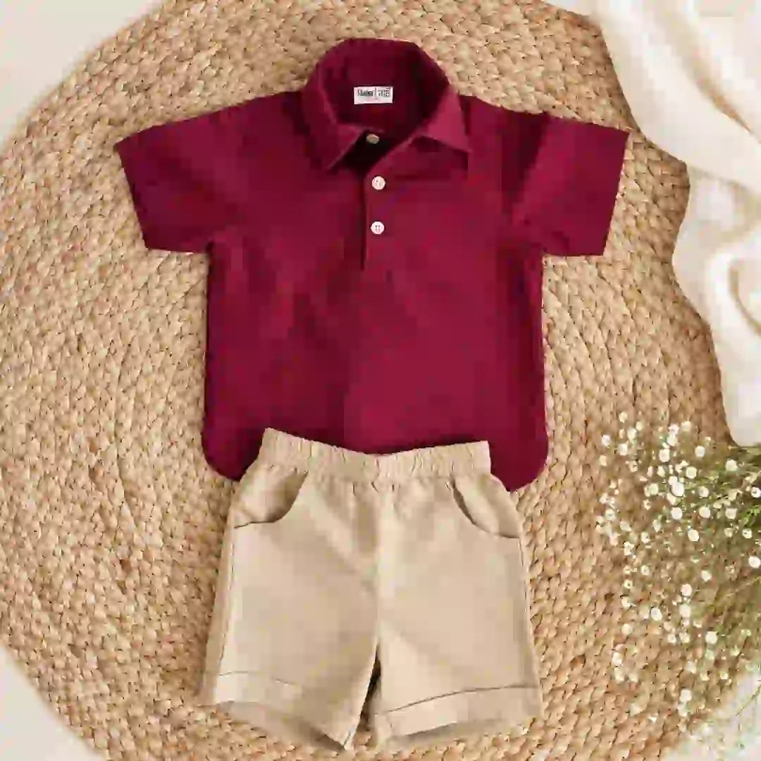 Flat lay of a maroon polo neck shirt with buttons and beige elastic-waist shorts with pockets