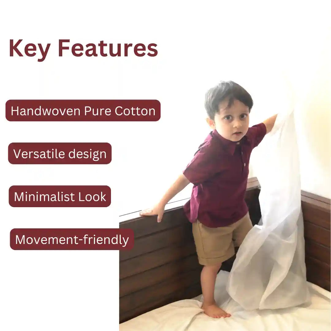 Boy in a maroon polo neck shirt and beige shorts standing on a bed, with key features of the set listed