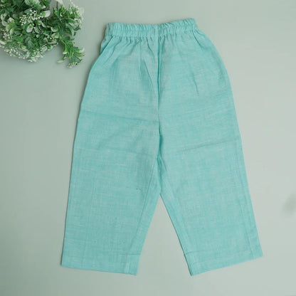 Flat lay of teal blue handwoven cotton pants for kids with soft elastic waistband