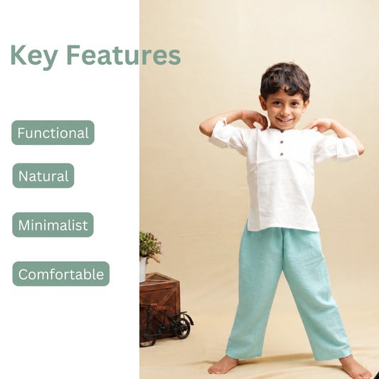 Child in teal blue cotton pants and white kurta with key features: functional, natural, minimalist, comfortable