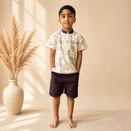 Boy wearing khadi kurta shorts set standing with pockets in hands