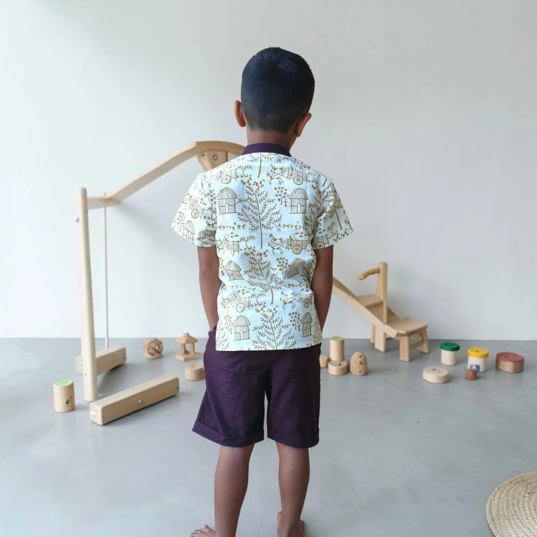 Back view of a handblock-printed Warli short kurta for children