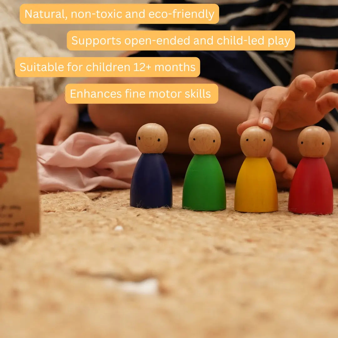 Child playing with Wooden Peg Dolls during open-ended play, encouraging imagination, fine motor skills, and creative storytelling